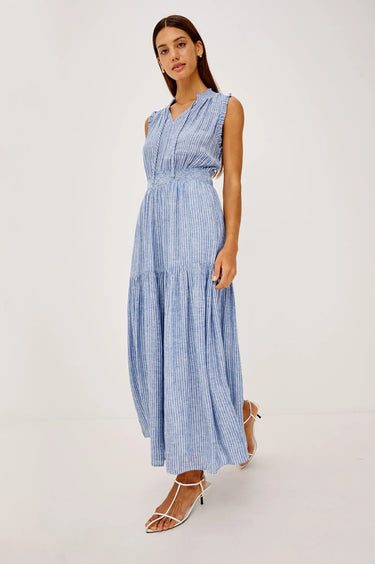 Woman wearing a barletta  striped dress on a white background