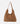 A slouchy brown suede hobo shoulder bag with a single strap, photographed against a clean white background.