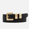 A black leather only with gold hardware on a white background 