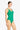 Woman wearing a green swimsuit on a white background