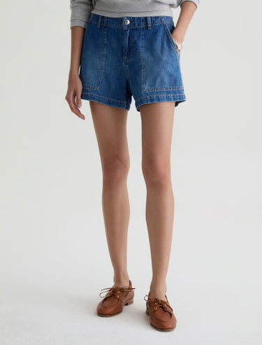 A waist down front image of medium wash denim jean shorts