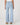 Light blue jeans worn by a person on a white background