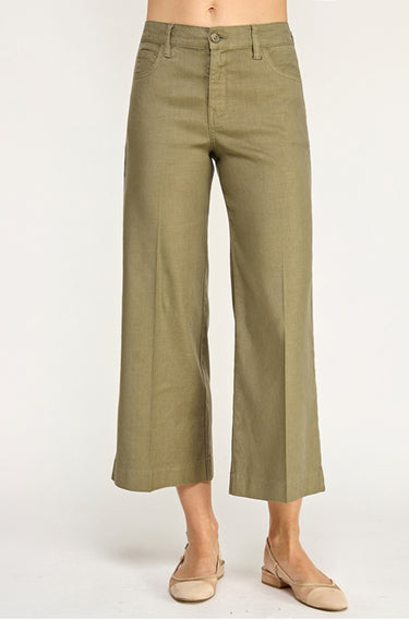 A woman wearing Olive green pants on a white background