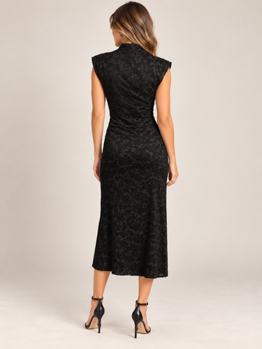 a woman wearing a black lace mock neck  sleeveless dress on a white background