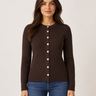 A woman modeling a dark brown ribbed knit cardigan sweater with a button-down front, paired with blue jeans, against a plain light beige background.