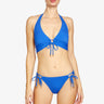 Woman wearing a blue bikini set on a white background