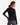Woman wearing a black long-sleeve top with a gray skirt on a white background