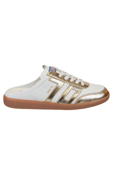 White and gold sneaker with brown sole on a white background