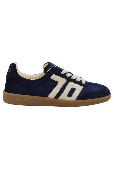 The side of a velvet blue sneaker with ‘70’ in white on the side on white background.