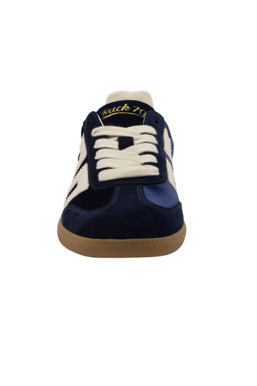 The front of a velvet blue sneaker on a white background