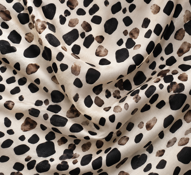 Close-up of Bella Dahl Painted Spots fabric in cream, black and brown showing its soft fluid texture