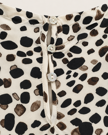 Close-up of Bella Dahl Painted Spots top showing three-button back neckline and keyhole detail