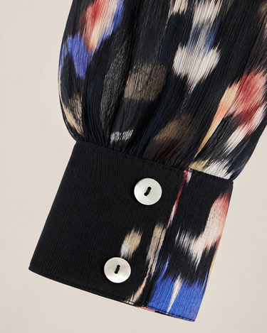 Close-up of Bella Dahl Blurred Bloom shirt showing textured flowy fabric and two-button cuff detail