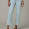 A woman wearing high rise cropped jeans