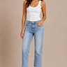 a woman wearing light wash cropped straight jeans on a neutral background