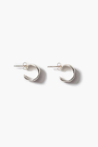 a pair of silver cuff hoops on a white background