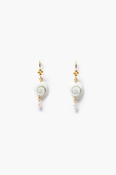 a pair of pearl heart earrings with a swirl design with gold hardware on a neutral background.