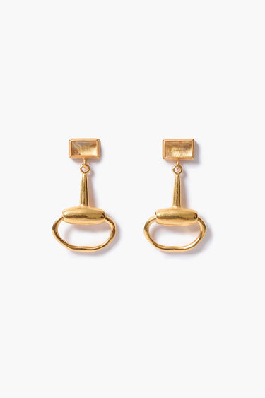 A pair of gold-tone horse-bit drop earrings with rectangular yellow gemstones on a white background