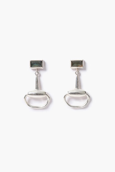 a pair of silver horsebit earrings with a labradorite stone on a white background.
