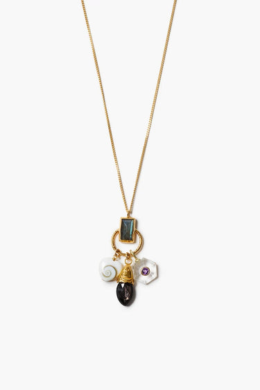 A gold necklace with a  an embellished hypersthene fish, shiva shell heart, and clear quartz inlaid with amethyst on a white background