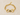 A gold horsebit chain bracelet with a clear square-cut gemstone in the center on beige table