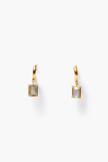 Small gold hoop with a square labradorite pendant dangling from hoop on a white background