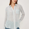 Woman wearing a striped shirt and jeans on a white background