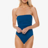 Woman wearing a blue strapless swimsuit on a white background