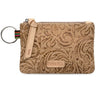 A tan tooled leather wristlet pouch with a matching leather key ring and strap, featuring a colorful woven accent strip and a 'CONSUELA' brand patch on a white background.