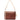 A brown embossed leather shoulder bag with a floral pattern, featuring a light beige leather strap, zipper pull, and hangtag, set against a plain white background.