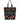 A black tote bag featuring a vibrant, colorful pattern of traditional Mexican Sacred Heart of Jesus motifs, including hearts with flames, roses, and floral details, set against a plain white background.