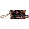 Consuela black crossbody bag with colorful heart and floral print, tan wristlet strap, and striped woven shoulder strap.