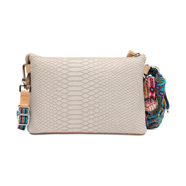 Beige textured handbag with a colorful strap on a white background