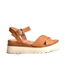 Tan sandal with a white sole on a white background