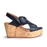 Navy wedge sandal with cork wedge sole on a white background