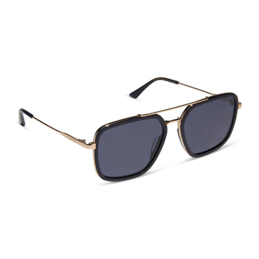 Sunglasses with gold frame and dark lenses on a white background