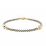 a grey shimmer and gold edges bracelet on a white background