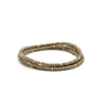 A bronze and gold beaded bracelet stack on a white background