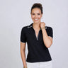 Woman wearing a black polo shirt with white trim on a light gray background