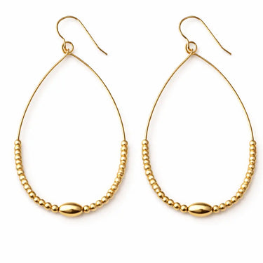 Gold beaded teardrop on a white background
