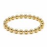 A gold beaded bracelet made of polished metallic round beads, in two different sizes, arranged in a circular shape on a plain white background.