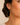 A woman wearing Gold beaded teardrop earrings