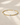 a oval silver and circle gold beaded bracelet on a neutral background