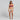 Woman wearing a purple bikini top and beige crochet sarong on a gray background