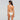 Woman wearing a white bikini with lace details on a gray background