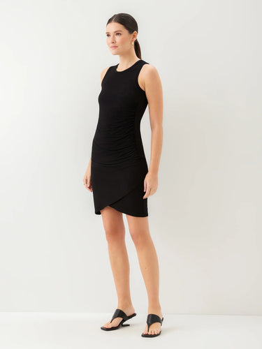 Woman wearing a black sleeveless dress on a white background