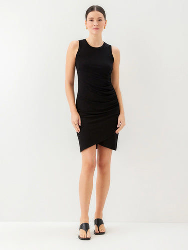 Woman wearing a black sleeveless dress on a white background