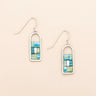 Pair of earrings with rectangular design on a beige background