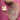 Set of earrings on a wooden stand with 'Scout' branding on a pink fabric background