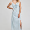 Woman wearing a light blue dress with a white background